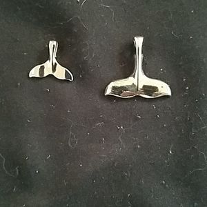 Whale tail pendants. One large and one small.